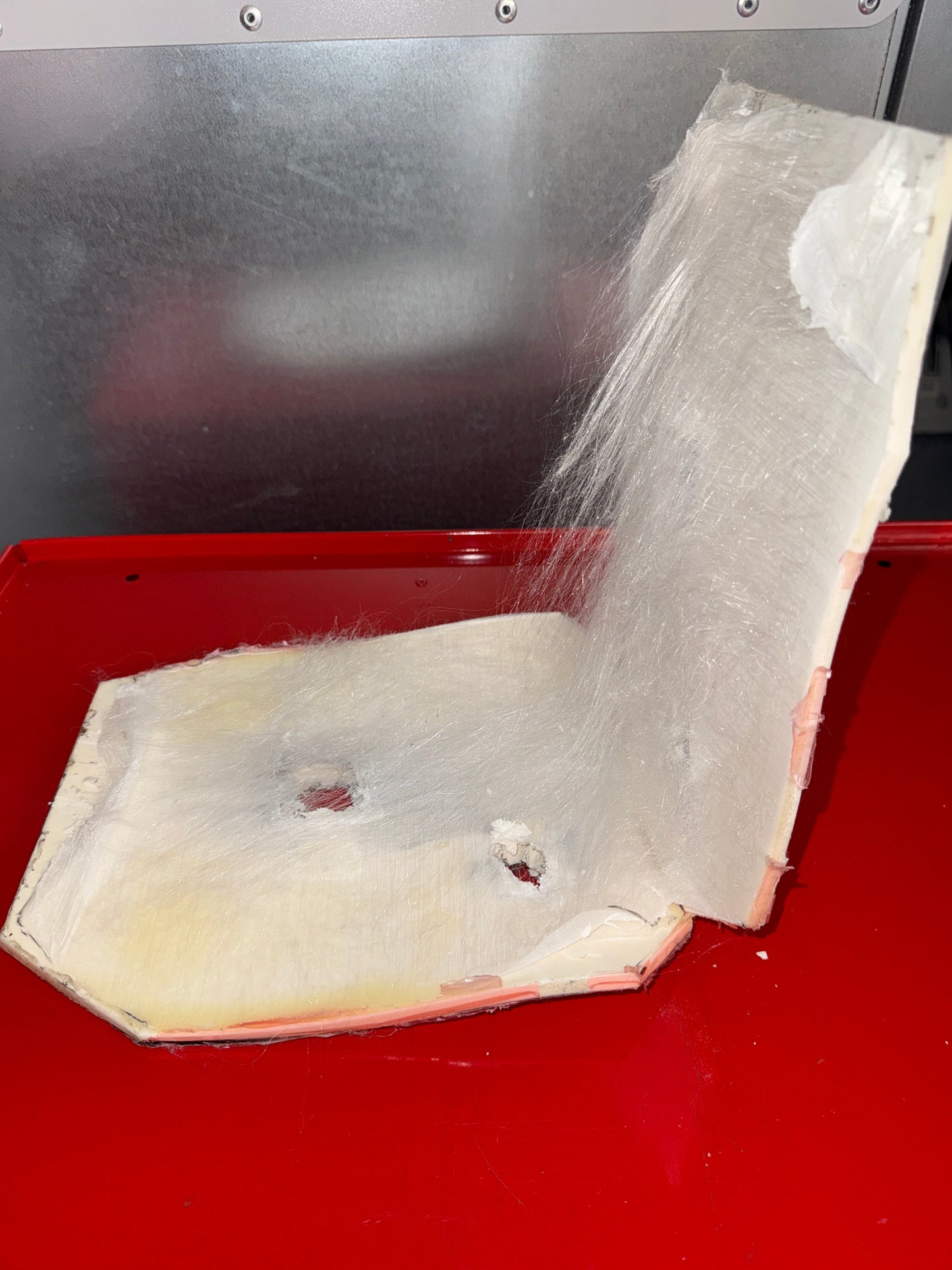 ARMORFILM™ ballistics adhesive between alumina ceramic and PE and post-strike with 2, .30 M2AP projectiles.