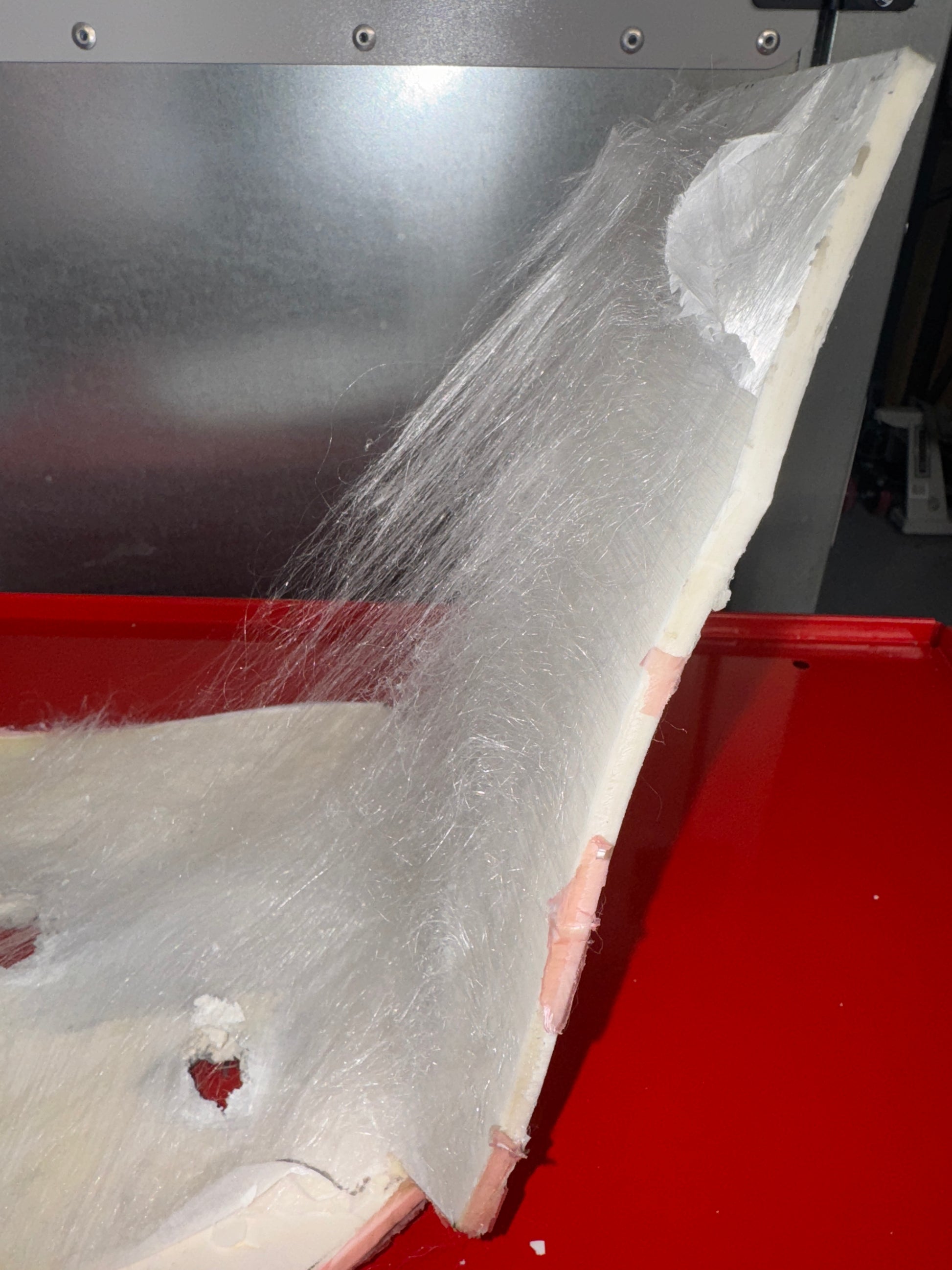 PE fiber is pulled apart by the power of ARMORFILM™ ballistic adhesive bonding